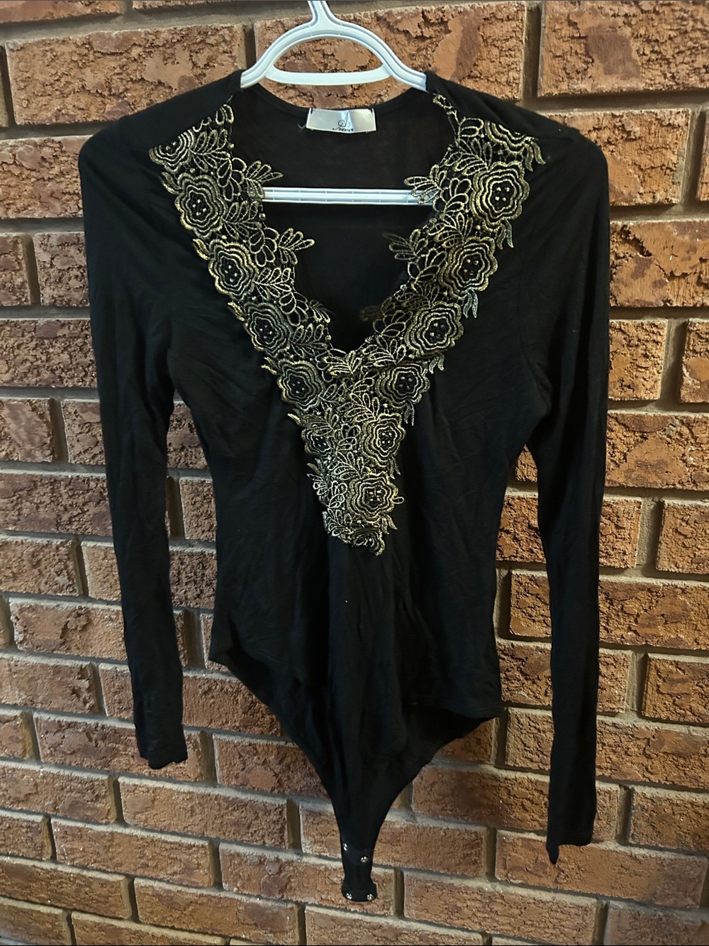 A3 Design Black Long-Sleeve Bodysuit with Gold Floral Lace V-Neckline